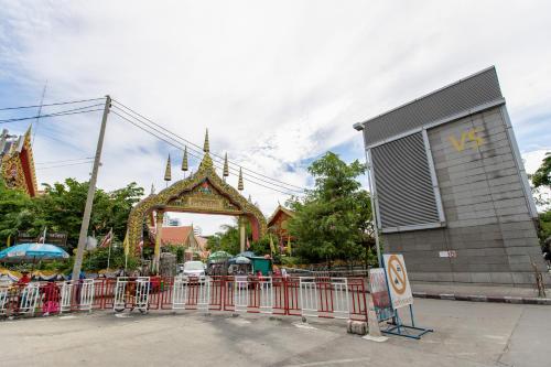 a gate in front of a temple with a building at Every Surawong in Bangkok