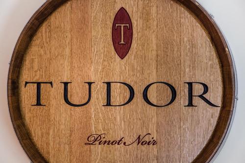 a round wooden box with the word tumor on it at The Vendange Carmel Inn & Suites in Carmel