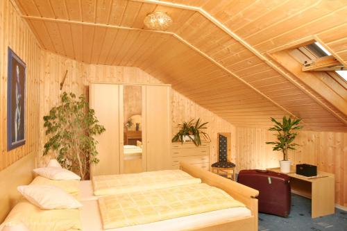 a bedroom with two beds in a room at Landhaus Brummer in Bad Birnbach