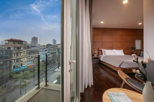 Postel nebo postele na pokoji v ubytování KEGON Hotel