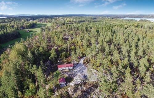 an aerial view of a house in a forest at Cozy Home In Ånimskog in Ånimskog