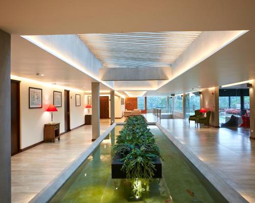 a lobby with a large aquarium in the middle of it at The Argyle Luxury Boutique in Hatton