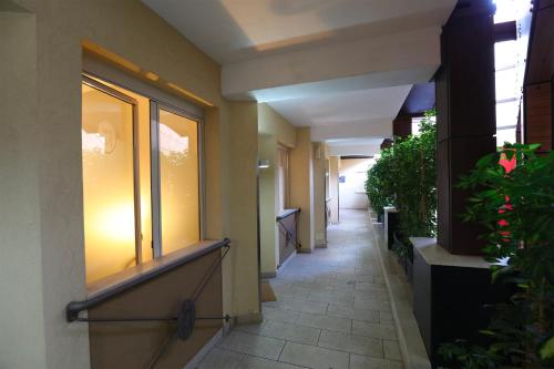 an empty hallway of a building with a light on at Grande Albergo Maugeri in Acireale