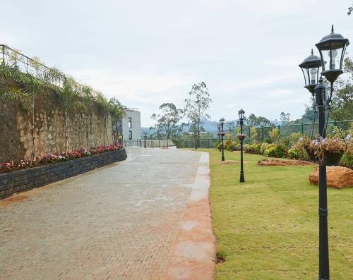 a walkway in a park with lights and flowers at The Argyle Luxury Boutique in Hatton