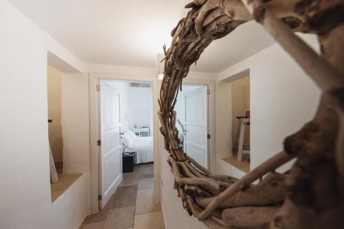 a mirror in the hallway of a house at Giovì Relais in Polignano a Mare