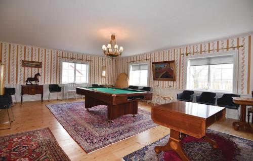 a living room with a pool table and a ping pong ball at Stunning Home In Tidaholm With 5 Bedrooms, Sauna And Wifi in Älvstorp