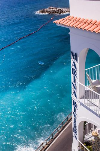 a view of the ocean from a building at Hotel Marina Riviera in Amalfi