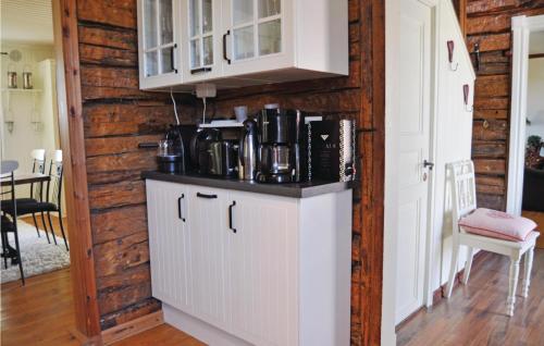 a kitchen with a counter with a coffee maker on it at Lovely Home In Mellerud With Kitchen in Mellerud