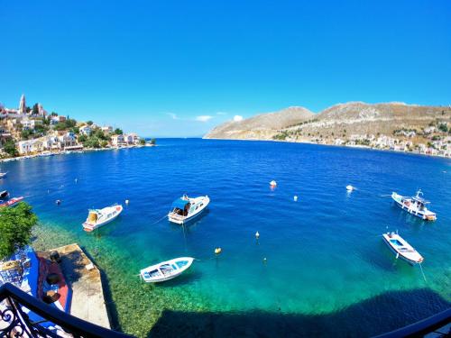 a group of boats in a large body of water at Moschos Mansion in Symi