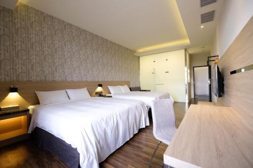 Katil atau katil-katil dalam bilik di Yu Chun Hotel