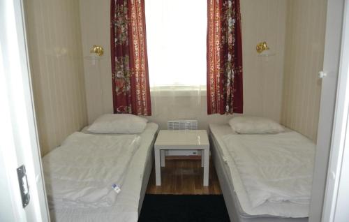 Postel nebo postele na pokoji v ubytování 3 Bedroom Cozy Home In Hemnes