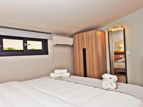 Postel nebo postele na pokoji v ubytování Notos Resort - Tristinika Sithonia