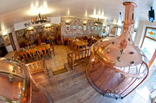 an overhead view of a restaurant with a large vase at Hotel Pivovarská bašta in Vrchlabí