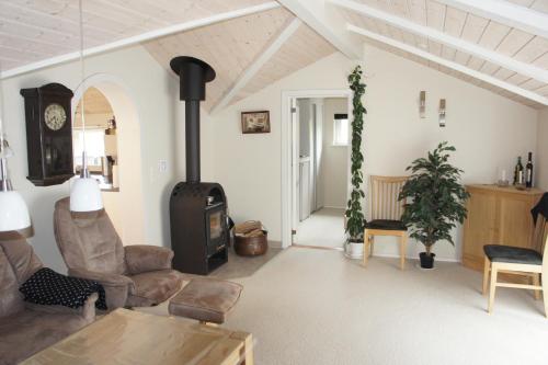 a living room with a wood stove in a room at Ådalen (ID 093) in Esbjerg