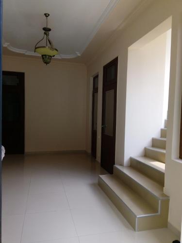 an empty room with stairs and a ceiling at Iberia 2019 in Batumi