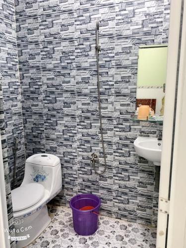 a bathroom with a toilet and a sink at Nam Du VIEW Guest House in Nam Du