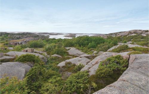 a view of a mountain with rocks and trees at One-Bedroom Holiday Home In Hunnebostrand in Hunnebostrand