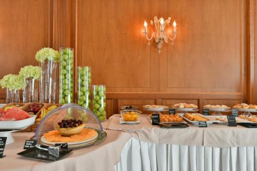 a buffet of food on tables in a room at Best Western Hotel Ferrari in Nola