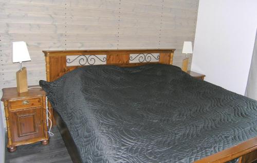 เตียงในห้องที่ Stunning home in Vittaryd with 4 Bedrooms, Sauna and WiFi