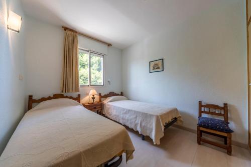Voodi või voodid majutusasutuse Villa vacaciones Benicassim toas