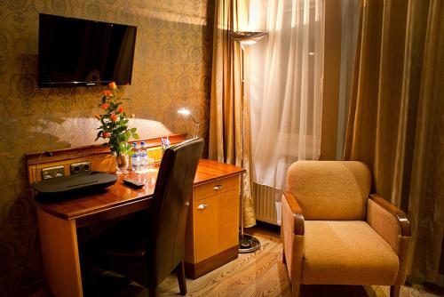 TV a/nebo společenská místnost v ubytování Hotel MCM Plus