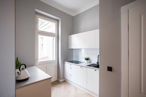 Kuchyňa alebo kuchynka v ubytovaní Homewell Boutique Apartments