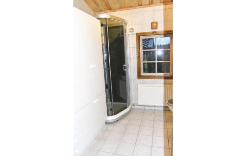 a bathroom with a shower and a toilet at 2 Bedroom Cozy Home In Vaggeryd in Ödestugu