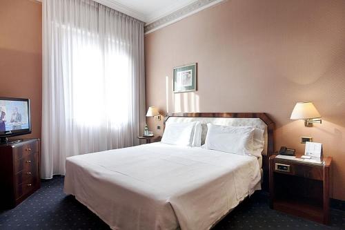 Posteľ alebo postele v izbe v ubytovaní Hotel Bristol