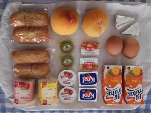 a lunch box with eggs bread and other food items at Hospederia del Comendador in Ocaña