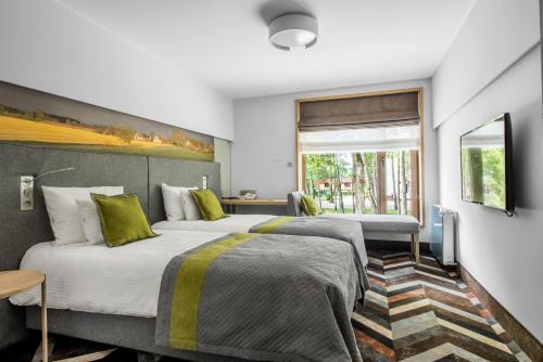 Кровать или кровати в номере Hotel Anders