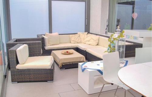 a living room with a couch and chairs and a table at Two-Bedroom Holiday Home In Neue Muhle in Neuemühle