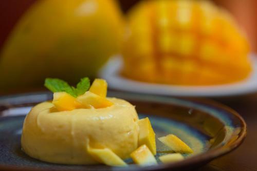a piece of food in a bowl with pineapple at Maison Perumal Pondicherry - A CGH Earth Experience in Puducherry