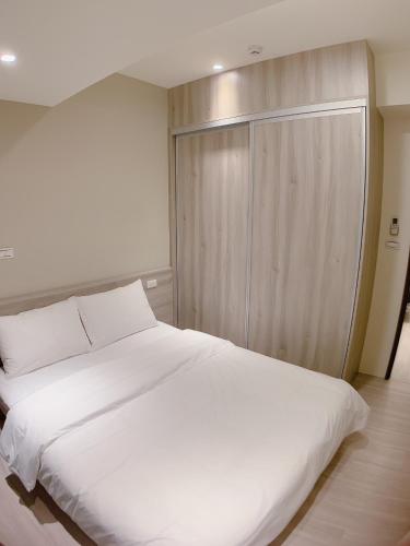 Postel nebo postele na pokoji v ubytování 想駐逢甲 Shine Residence