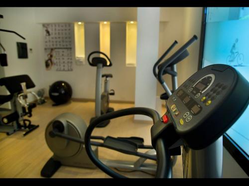 a room with a gym with a cell phone in it at Sure Hotel by Best Western Milano in Padova