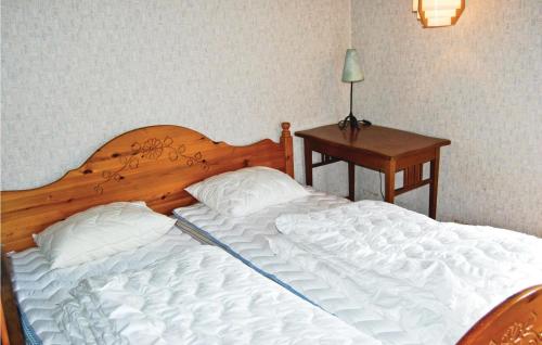 A bed or beds in a room at Kvighult