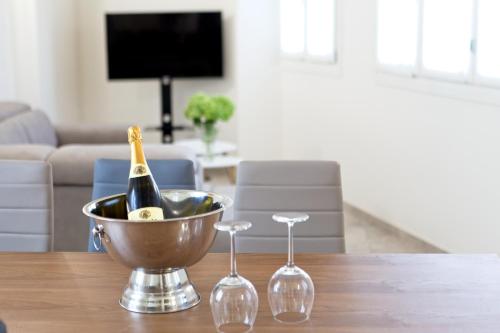 a bottle of champagne in a bucket on a table at CASA VACANZE MARCONI 22 in Marone