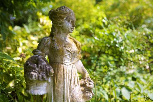 a statue of a woman holding a child at Hotel Villa Meererbusch in Meerbusch
