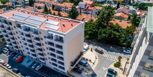 an overhead view of a building with solar panels on its roof at Adriatik Lux Apartments in Budva