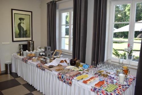 a buffet table with food and drinks on it at Eco Nieborów in Nieborów