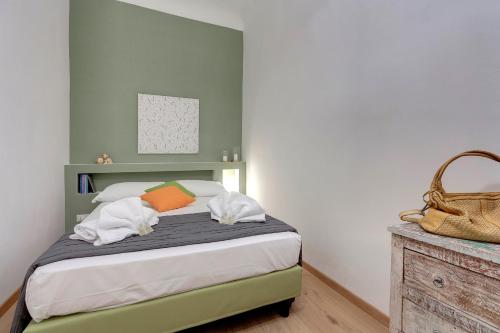 A bed or beds in a room at Borgo Apartment by Mamo Florence
