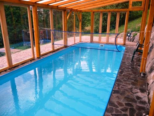 an overhead view of a swimming pool with a pergola at Horská Chata Hříbek in Benecko