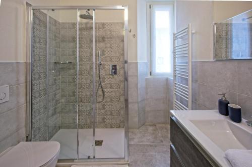 a bathroom with a shower and a sink at CASA VACANZE MARCONI 22 in Marone