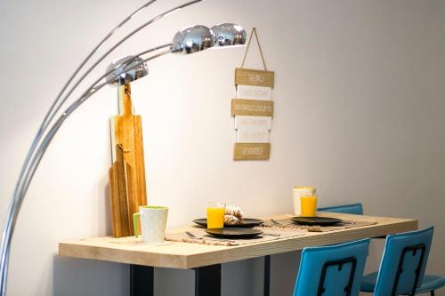 a table with a lamp on top of it at #FLH - Boho Chic Apartment, Agia Sofia District in Thessaloniki