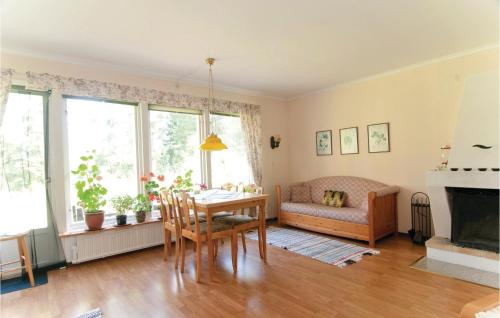 a living room with a table and a couch at Awesome Home In Lrbro With 1 Bedrooms in Ire