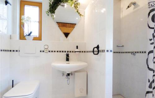 a bathroom with a sink and a toilet at Cozy Home In Körperich-Obersgegen in Obersgegen