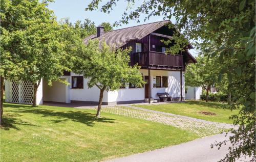 a house with a tree in front of it at Ferienhaus 4 In Thalfang in Thalfang