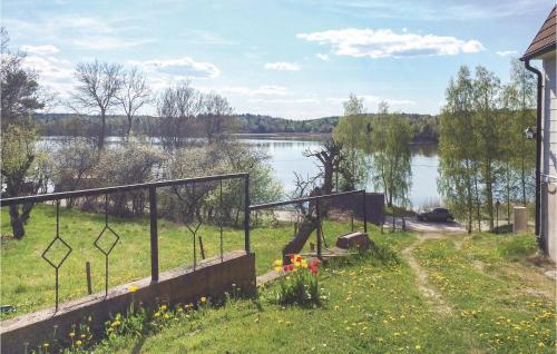 a view of a lake from a house at 2 Bedroom Beautiful Home In Rimforsa in Skälhamra