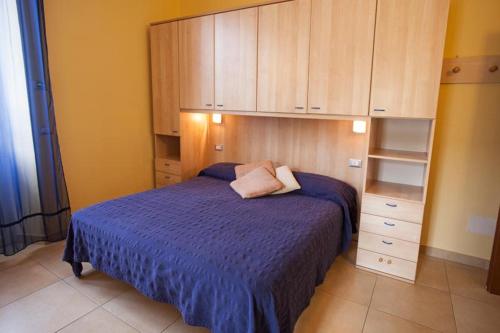 Ein Bett oder Betten in einem Zimmer der Unterkunft Residence Conchiglia Aparthotel