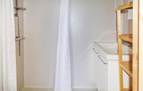 a white shower curtain in a white bathroom at Gorgeous Home In Dirdal With Wifi in Dirdal
