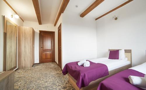 Postel nebo postele na pokoji v ubytování Coin Hotel